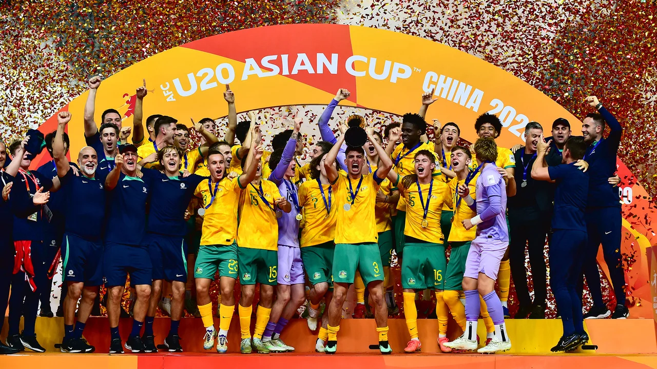 Australian U20 soccer team celebrating on stage with confetti after winning the U20 Asian Cup China 2025.