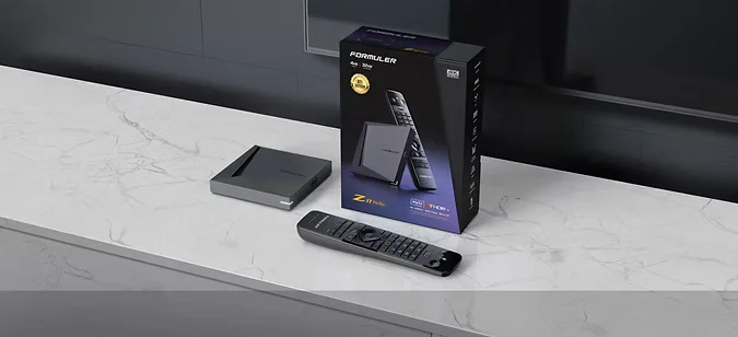 FORMULER Z11 Pro Max media streaming device with remote control and branded packaging on a marble surface.
